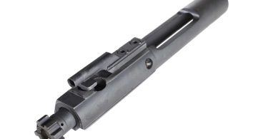 A bolt carrier group component shown at an angle on a white background