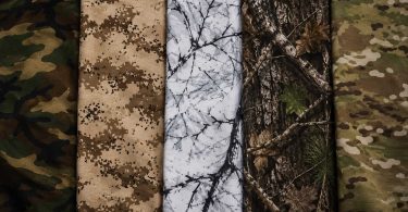 Five camouflage fabric patterns displayed side by side, including woodland, desert, snow, tree bark, and multicam designs.